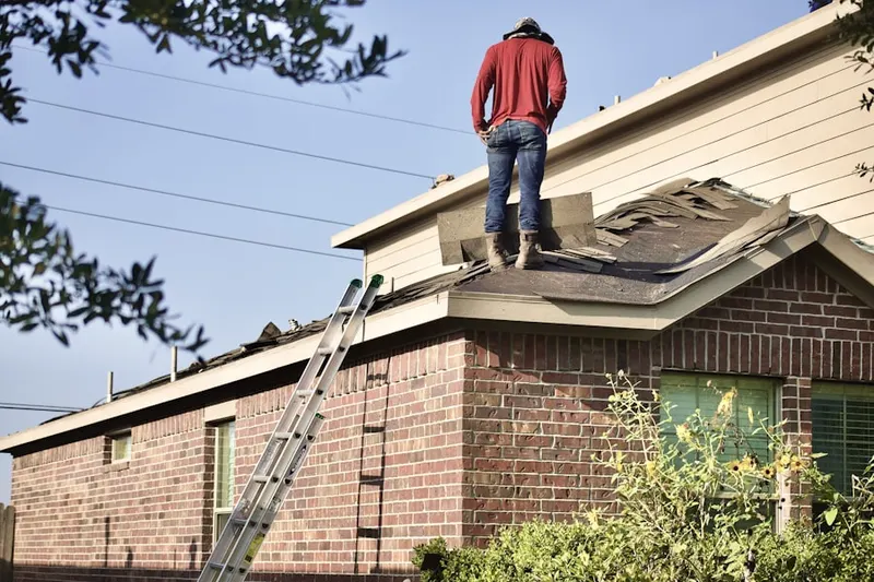 Professional roofer working on a residential roof in South Bay Lakes